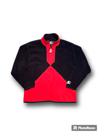 a red and black flee jacket on a black background